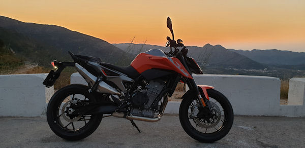 KTM 790 Duke at sunset on the top of Coll de Rates.