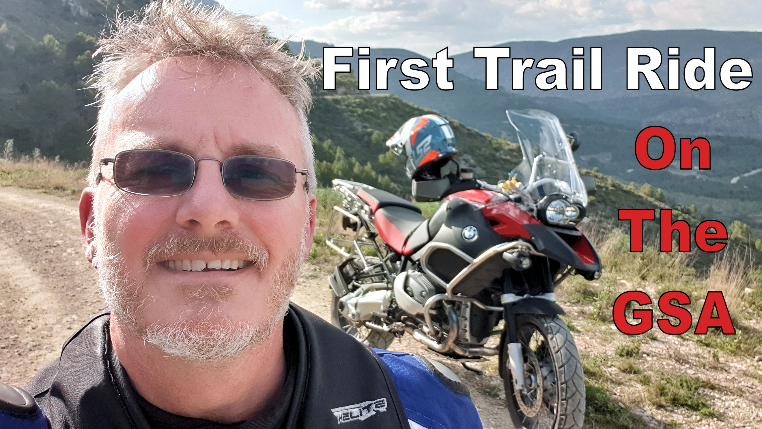 Chris from Bikers España stood with a BMW R1200GSA in the mountains